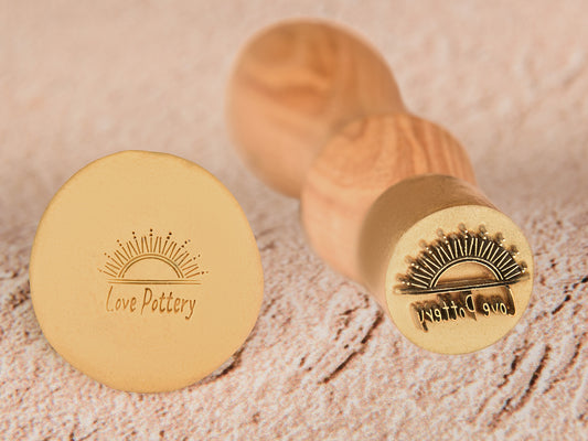 Personalized pottery stamps for imprinting one-of-a-kind designs onto a wide range of soft surfaces (ceramics, clay, candles, soap, and more).